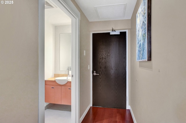 1260 NW Naito Pkwy Unit 103, Portland, OR 97209 - hall featuring a sink and dark wood-style floors