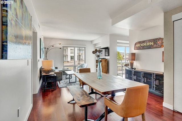 1260 NW Naito Pkwy Unit 103, Portland, OR 97209 - dining room with wood finished floors and baseboards