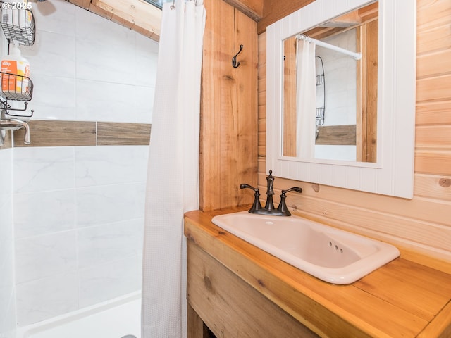 bathroom with vanity and a shower stall