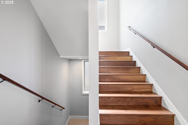 stairway featuring baseboards