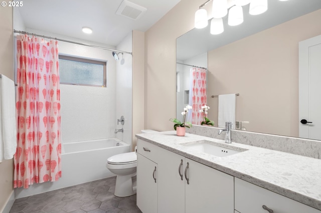 bathroom featuring vanity, shower / tub combo, toilet, and visible vents