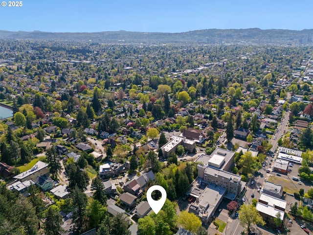 birds eye view of property with a mountain view