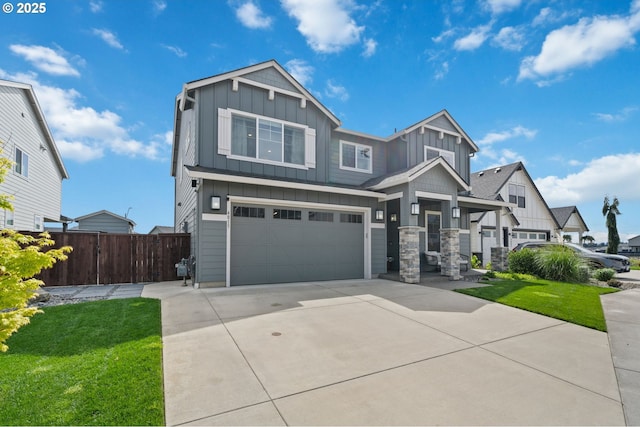 4815 S 12th Cir, Ridgefield, WA 98642 - craftsman inspired home with board and batten siding, driveway, an attached garage, and stone siding
