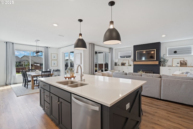 4815 S 12th Cir, Ridgefield, WA 98642 - kitchen featuring dishwasher, light countertops, wood finished floors, hanging light fixtures, and recessed lighting