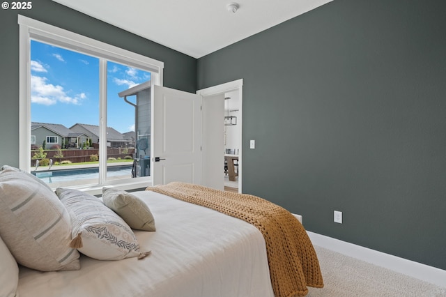 4815 S 12th Cir, Ridgefield, WA 98642 - bedroom featuring carpet floors, baseboards, and a residential view