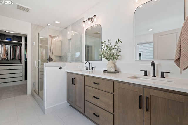 4815 S 12th Cir, Ridgefield, WA 98642 - bathroom with a stall shower, double vanity, a walk in closet, and recessed lighting