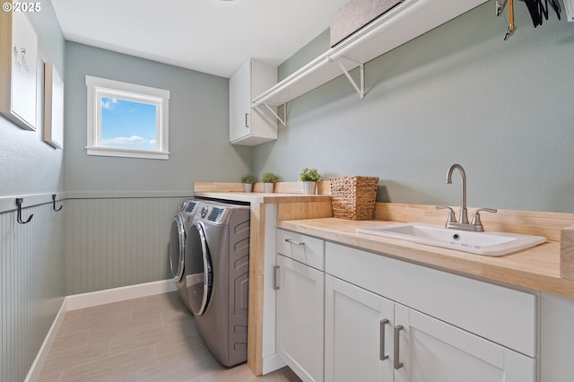 4815 S 12th Cir, Ridgefield, WA 98642 - laundry room featuring washer and clothes dryer, cabinet space, and baseboards