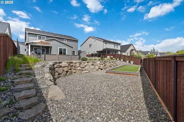 4815 S 12th Cir, Ridgefield, WA 98642 - fenced backyard with a bocce ball area and a residential view