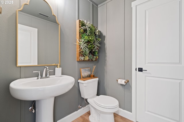 4815 S 12th Cir, Ridgefield, WA 98642 - bathroom with toilet, wood finished floors, baseboards, and a sink