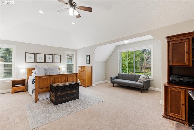 bedroom featuring baseboards, light colored carpet, recessed lighting, a ceiling fan, and vaulted ceiling