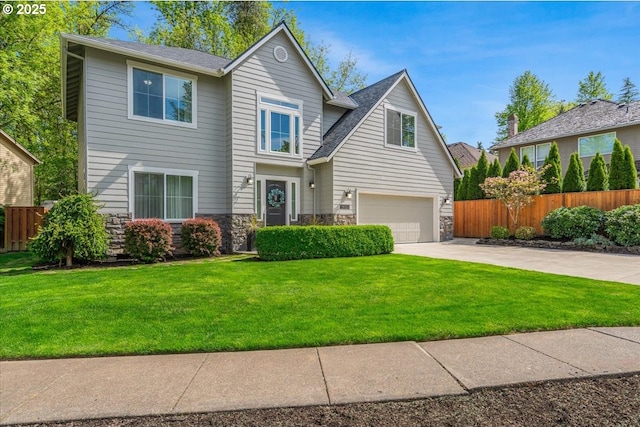 view of front facade featuring fence, an attached garage, stone siding, a front yard, and concrete driveway