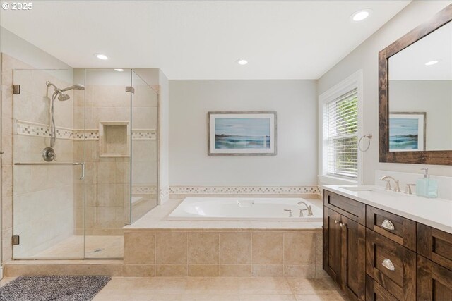 full bathroom featuring a garden tub, vanity, recessed lighting, tile patterned floors, and a shower stall