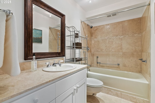 bathroom featuring shower / washtub combination, tile patterned flooring, vanity, and toilet