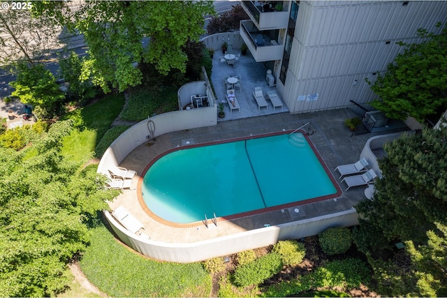 view of swimming pool with a fenced in pool and a patio