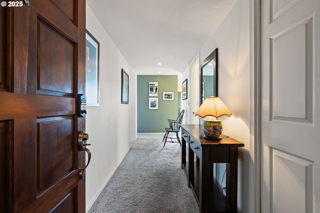 hallway with light colored carpet