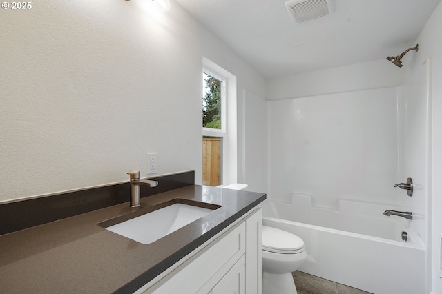 full bath with washtub / shower combination, vanity, toilet, and visible vents