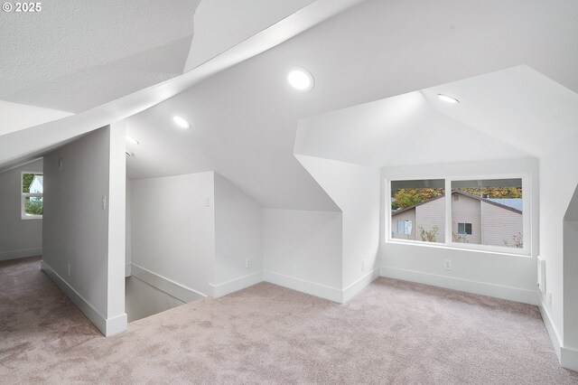 bonus room with carpet flooring, recessed lighting, and lofted ceiling