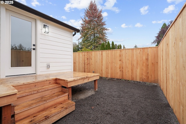 view of yard with fence and a wooden deck