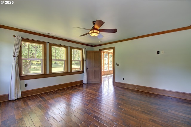 empty room with crown molding, ceiling fan, and dark hardwood / wood-style flooring