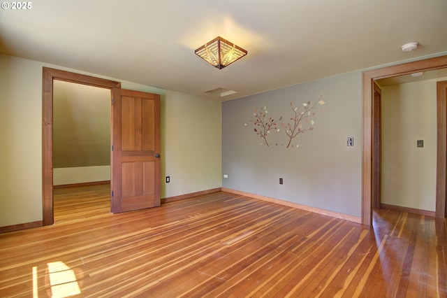 unfurnished room featuring light hardwood / wood-style flooring