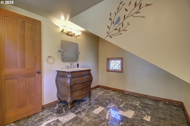 bathroom featuring vanity and vaulted ceiling