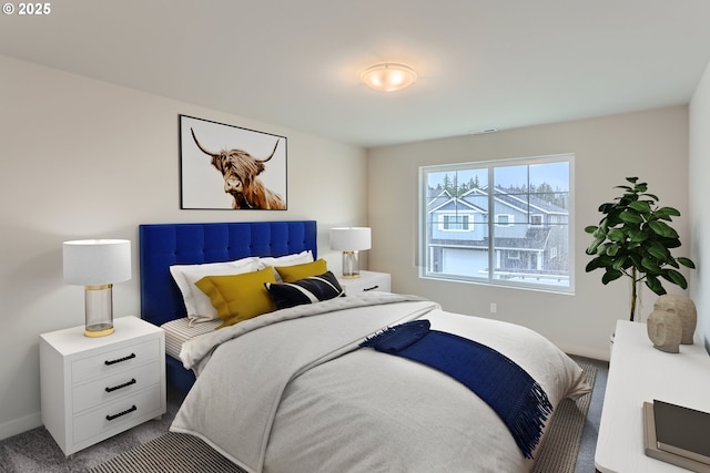 carpeted bedroom with baseboards