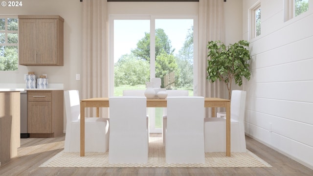 dining room featuring light wood-style flooring and a wealth of natural light