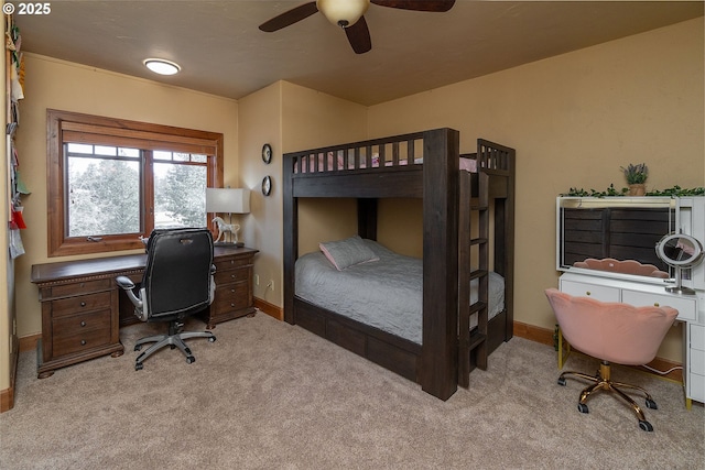 bedroom featuring a ceiling fan, carpet, and baseboards