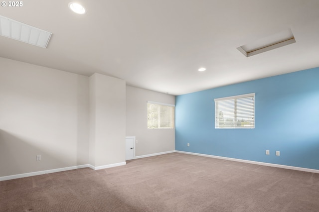 3962 SE Discovery St, Hillsboro, OR 97123 - carpeted spare room featuring visible vents, attic access, baseboards, and recessed lighting
