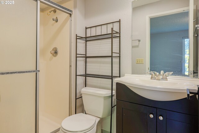 2330 SE Brookwood Ave Unit 222, Hillsboro, OR 97123 - full bathroom with a shower stall, toilet, and vanity