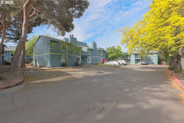 2330 SE Brookwood Ave Unit 222, Hillsboro, OR 97123 - view of asphalt street featuring curbs and a residential view