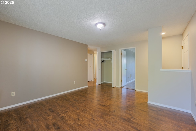 2330 SE Brookwood Ave Unit 222, Hillsboro, OR 97123 - spare room featuring wood finished floors, a textured ceiling, and baseboards