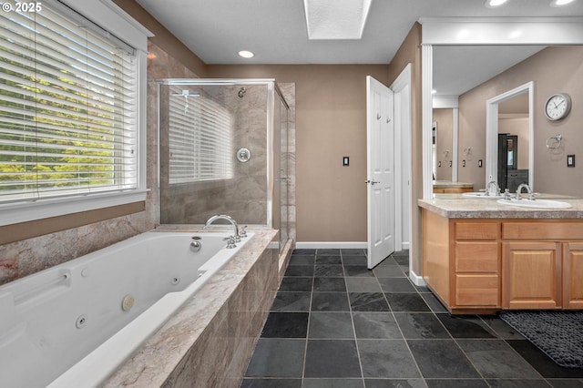 14411 SW 128th Pl, Tigard, OR 97224 - bathroom featuring a whirlpool tub, vanity, baseboards, a stall shower, and recessed lighting