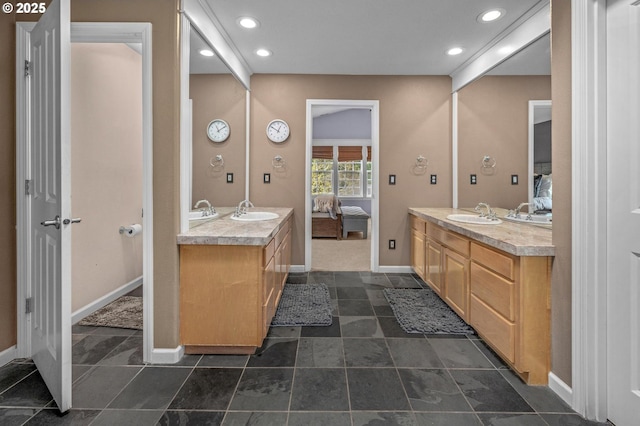 14411 SW 128th Pl, Tigard, OR 97224 - ensuite bathroom with two vanities, ensuite bath, baseboards, and a sink