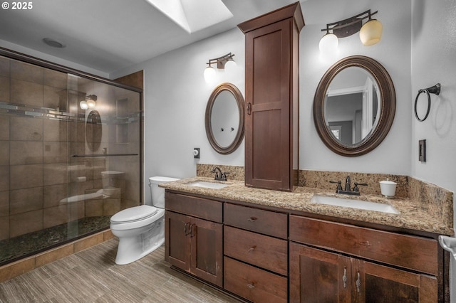 14411 SW 128th Pl, Tigard, OR 97224 - full bath featuring toilet, double vanity, a sink, and a stall shower