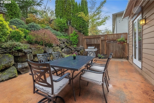 14411 SW 128th Pl, Tigard, OR 97224 - view of patio with area for grilling, outdoor dining space, and fence