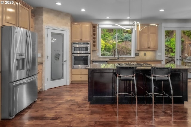 14411 SW 128th Pl, Tigard, OR 97224 - kitchen with recessed lighting, light brown cabinets, a sink, and appliances with stainless steel finishes