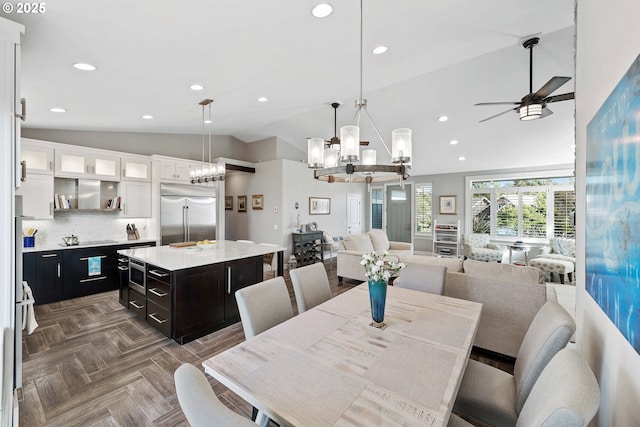 dining area with high vaulted ceiling, recessed lighting, and ceiling fan