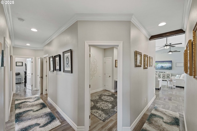 corridor featuring crown molding, recessed lighting, wood finished floors, and baseboards