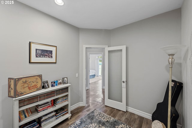 interior space featuring wood finished floors and baseboards