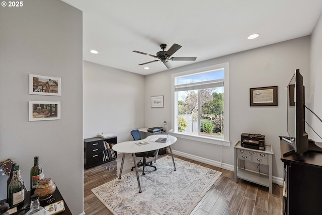 home office featuring recessed lighting, wood finished floors, a ceiling fan, and baseboards