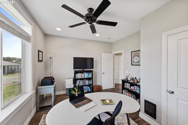 office space featuring dark wood-style flooring, recessed lighting, visible vents, a ceiling fan, and baseboards