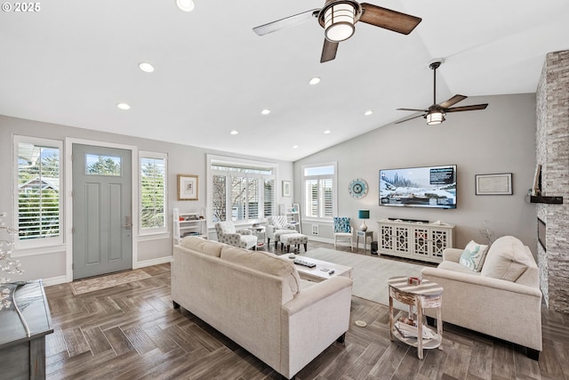 living area with a ceiling fan, recessed lighting, vaulted ceiling, and baseboards