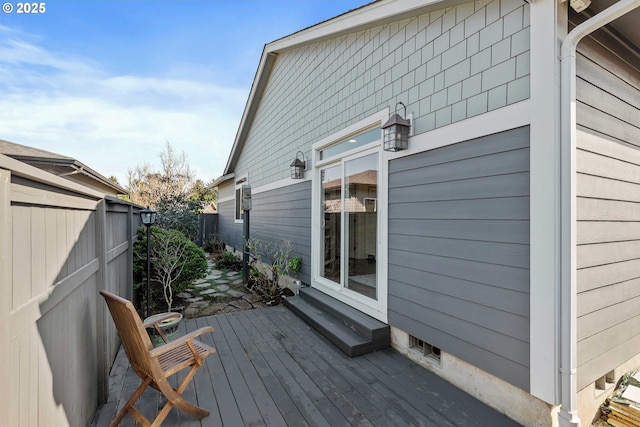 deck featuring entry steps and fence