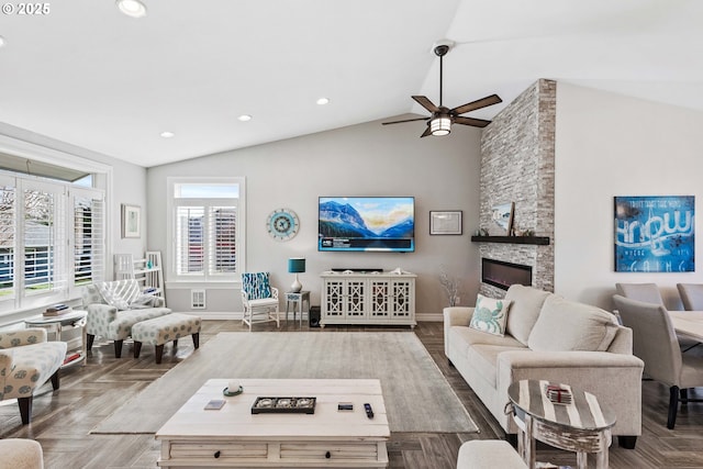 3220 Natalie Way, Bandon, OR 97411 - living room with recessed lighting, ceiling fan, baseboards, a stone fireplace, and high vaulted ceiling