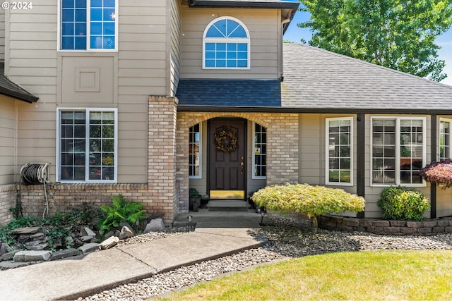 3644 Fall Creek Ct, Keizer, OR 97303 - view of exterior entry with a shingled roof and brick siding