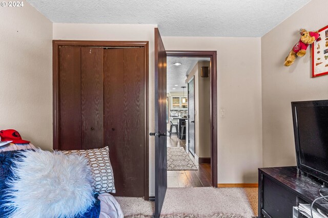 3644 Fall Creek Ct, Keizer, OR 97303 - carpeted bedroom with a textured ceiling, baseboards, and a closet