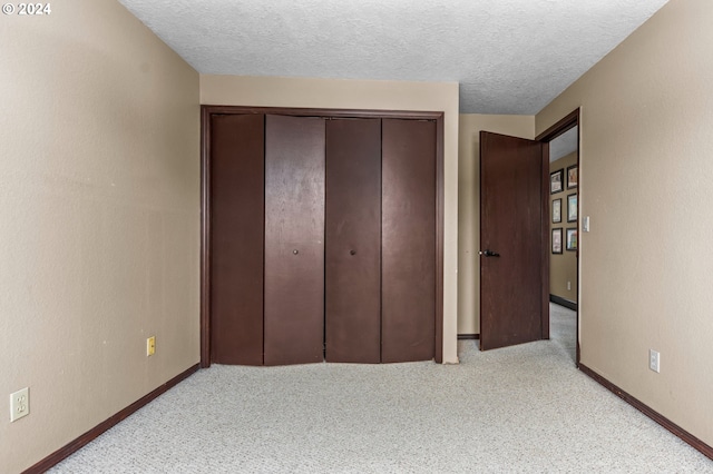 3644 Fall Creek Ct, Keizer, OR 97303 - unfurnished bedroom with carpet floors, a closet, a textured ceiling, and baseboards