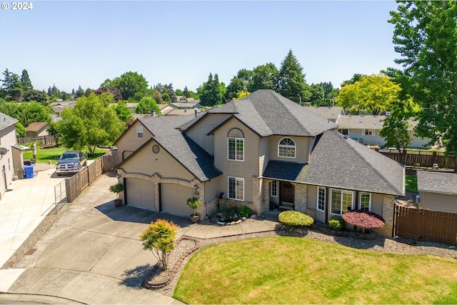 3644 Fall Creek Ct, Keizer, OR 97303 - traditional home featuring a shingled roof, driveway, an attached garage, and brick siding