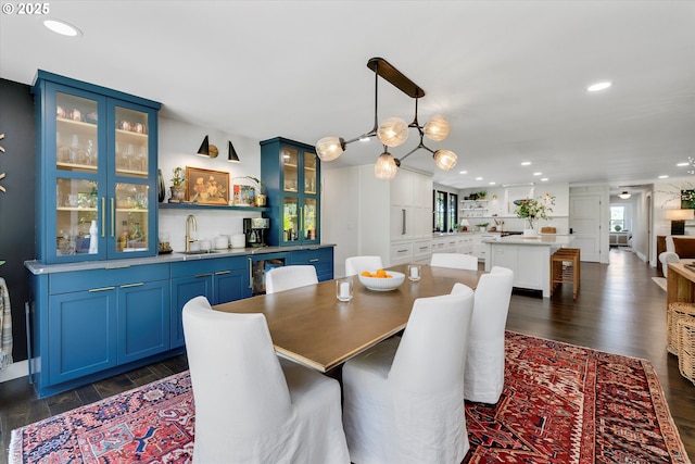 11700 S Makin Ln, Canby, OR 97013 - dining area featuring dark wood finished floors, recessed lighting, beverage cooler, and a chandelier